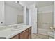 Clean bathroom featuring a large vanity, bright walls, and a shower-tub combination at 5938 Rock Ct, Union City, GA 30291