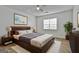 Comfortable bedroom featuring neutral colors, ceiling fan, soft rug, and wooden furniture at 5938 Rock Ct, Union City, GA 30291