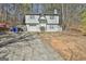 Two-story home with a grey exterior, complemented by a long driveway, and a two-car garage at 5938 Rock Ct, Union City, GA 30291