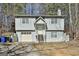 Charming two-story home featuring a garage and traditional architectural details at 5938 Rock Ct, Union City, GA 30291