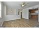 Bright living room featuring new wood floors seamlessly flowing into the adjacent kitchen at 5938 Rock Ct, Union City, GA 30291