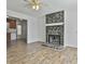 Spacious living room featuring a stone fireplace and a view to the kitchen at 5938 Rock Ct, Union City, GA 30291