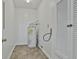 Neutral-colored utility room, including a water heater, a door, and a storage closet at 5938 Rock Ct, Union City, GA 30291