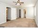 Main bedroom with neutral carpet and access to the bathroom at 117 Parkway Ct, Dallas, GA 30157