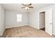 A bedroom with neutral walls, a ceiling fan, carpeted floors, and a window at 117 Parkway Ct, Dallas, GA 30157