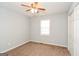 Bedroom features neutral walls, carpeted floors, a ceiling fan, and a closet at 117 Parkway Ct, Dallas, GA 30157