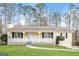 Charming single-story home with a inviting front porch and well-maintained lawn at 117 Parkway Ct, Dallas, GA 30157