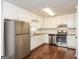 Modern kitchen featuring stainless steel appliances, granite countertops, and white cabinets at 117 Parkway Ct, Dallas, GA 30157