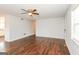 Open living room featuring hardwood floors, neutral paint, and a ceiling fan at 117 Parkway Ct, Dallas, GA 30157
