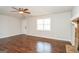 Bright living room with hardwood floors, a ceiling fan, and natural light at 117 Parkway Ct, Dallas, GA 30157