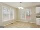 Bright dining area featuring tile flooring and two large windows, perfect for enjoying meals with ample natural light at 495 N Oakland Cir, Mcdonough, GA 30253