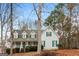 Charming two-story home featuring a welcoming front porch with green shutters and a well-maintained front yard at 495 N Oakland Cir, Mcdonough, GA 30253