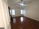 Spacious bedroom with hardwood floors, vaulted ceiling, and two windows at 1630 Versailles Sw Dr, Atlanta, GA 30331