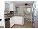 Well-lit kitchen features stainless appliances, granite counters, and ample cabinet space at 1630 Versailles Sw Dr, Atlanta, GA 30331