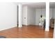 Open-concept living area with decorative pillars, hardwood floors, and natural light at 1630 Versailles Sw Dr, Atlanta, GA 30331