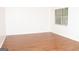 Spacious living room with wood flooring, white walls and bright natural light at 1630 Versailles Sw Dr, Atlanta, GA 30331