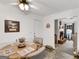 Bright dining area features tile floor, and opens to living room with fireplace at 220 Melrose Way, Mcdonough, GA 30252