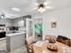 Open kitchen connected to a breakfast nook, featuring neutral cabinetry and plenty of natural light at 220 Melrose Way, Mcdonough, GA 30252