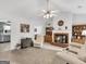 Cozy living room featuring a brick fireplace, plush seating, and neutral decor at 220 Melrose Way, Mcdonough, GA 30252