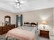Charming main bedroom has ceiling fan, and windows with backyard view at 220 Melrose Way, Mcdonough, GA 30252