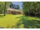 Expansive backyard featuring a lush lawn and inviting decks for relaxation and entertainment at 170 Majesty Ln, Fayetteville, GA 30215