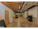 Large unfinished basement area leading to garage door at 170 Majesty Ln, Fayetteville, GA 30215