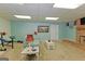 Finished basement area with carpet and partial brick wall leading to an open seating area at 170 Majesty Ln, Fayetteville, GA 30215