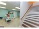 Finished basement area with carpet and stairway leading to an open seating area at 170 Majesty Ln, Fayetteville, GA 30215