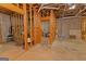 Unfinished basement with bare concrete floor and wooden frame walls at 170 Majesty Ln, Fayetteville, GA 30215
