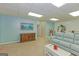 Finished basement area featuring neutral carpet, a wooden dresser, and blue-painted walls at 170 Majesty Ln, Fayetteville, GA 30215