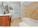 Bright bathroom with tile floors, double sinks, and a shower and bathtub combination at 170 Majesty Ln, Fayetteville, GA 30215