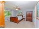 This spacious bedroom has a ceiling fan, two closets, and a window with natural light at 170 Majesty Ln, Fayetteville, GA 30215