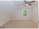 Neutral bonus room with ceiling fan, recessed lighting, and window overlooking the backyard at 170 Majesty Ln, Fayetteville, GA 30215