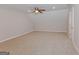 Large bonus room featuring new carpet, neutral paint, and bright overhead lighting at 170 Majesty Ln, Fayetteville, GA 30215