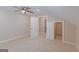 Bright, neutral bonus room with ceiling fan, recessed lighting, and two doorways at 170 Majesty Ln, Fayetteville, GA 30215