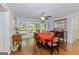 Formal dining room with hardwood floors, traditional furniture, and sliding glass doors at 170 Majesty Ln, Fayetteville, GA 30215