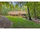Beautiful brick home with a lush green lawn and mature trees at 170 Majesty Ln, Fayetteville, GA 30215