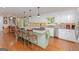 Bright kitchen featuring granite island with seating, stainless steel appliances and custom cabinetry at 170 Majesty Ln, Fayetteville, GA 30215