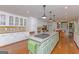 Large open kitchen with a granite island, stainless steel appliances, and custom cabinetry at 170 Majesty Ln, Fayetteville, GA 30215