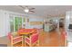 Open concept eat-in kitchen featuring white cabinets, stainless appliances, and access to the outdoor deck at 170 Majesty Ln, Fayetteville, GA 30215