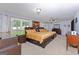 Spacious main bedroom offering two beds, ambient lighting, and large windows at 170 Majesty Ln, Fayetteville, GA 30215