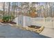 Backyard shed with a white picket fence and garden beds. Storage for all your lawn and garden supplies at 106 Robinson Bend Trl, Peachtree City, GA 30269