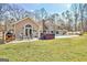 Expansive backyard with a pool, hot tub, patio, and lush green space at 106 Robinson Bend Trl, Peachtree City, GA 30269
