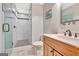 Bathroom featuring tiled floors, an oversized vanity, and a walk-in shower with a glass enclosure at 106 Robinson Bend Trl, Peachtree City, GA 30269