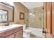 Bathroom with a white sink, toilet, and tiled shower/tub with glass door at 106 Robinson Bend Trl, Peachtree City, GA 30269