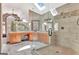 Spacious bathroom with a glass-enclosed shower, double vanity, and a skylight at 106 Robinson Bend Trl, Peachtree City, GA 30269