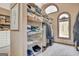 Spacious walk-in closet with custom built-in shelving and drawers at 106 Robinson Bend Trl, Peachtree City, GA 30269