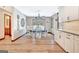 View of the dining area featuring a window and wooden trim with a modern kitchen to the side at 106 Robinson Bend Trl, Peachtree City, GA 30269