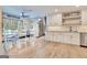 A modern dining area with view to the outside pool featuring a window and access to kitchen cabinetry at 106 Robinson Bend Trl, Peachtree City, GA 30269