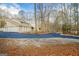 Charming home with an attached garage, spacious driveway, and mature trees for enhanced privacy and curb appeal at 106 Robinson Bend Trl, Peachtree City, GA 30269